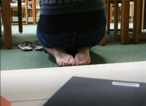 teachers feet candid|Candid teacher's feet in the library .